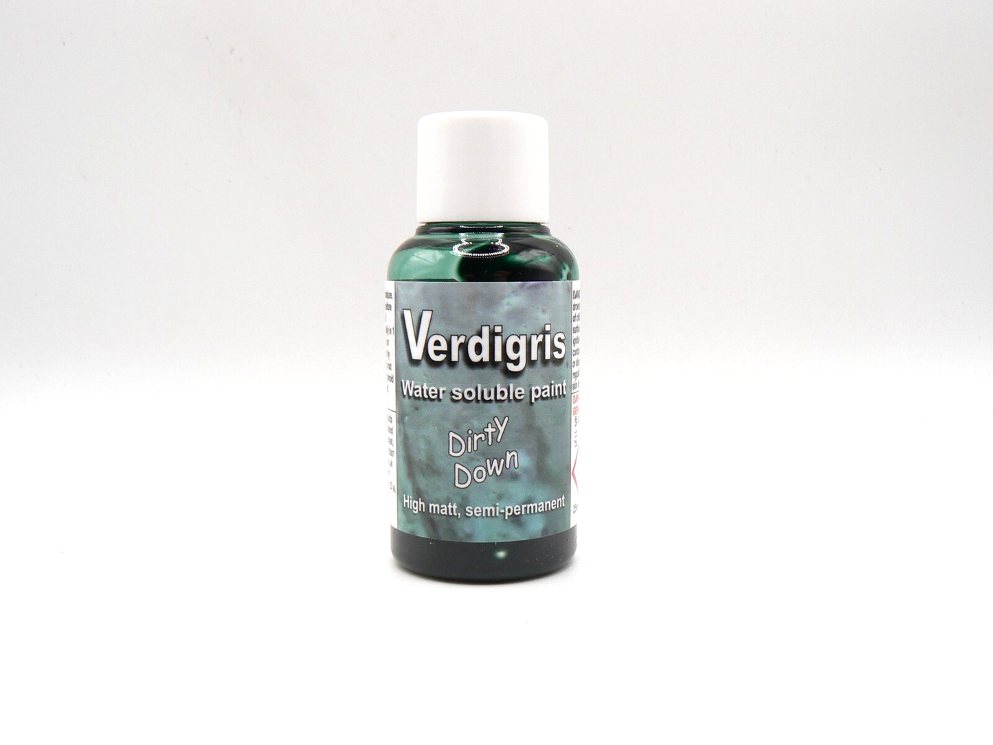 A 25ml bottle of Dirty Down Verdigris Effect paint, showcasing a sample of a miniature or model piece with a vibrant, realistic green patina.